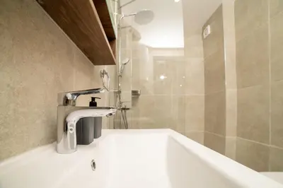 a bathroom with a sink and a bath tub at Luxury Apartment with Green Terrace, Porto Milena View and Private Garage in Ulcinj