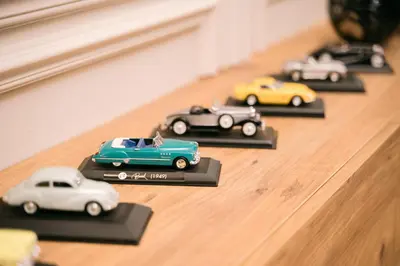 a group of toy cars sitting on a table at Luxury Apartment with Green Terrace, Porto Milena View and Private Garage in Ulcinj