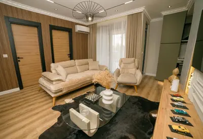 a living room with a couch and two chairs at Luxury Apartment with Green Terrace, Porto Milena View and Private Garage in Ulcinj