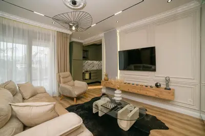 a living room with a couch and a tv at Luxury Apartment with Green Terrace, Porto Milena View and Private Garage in Ulcinj