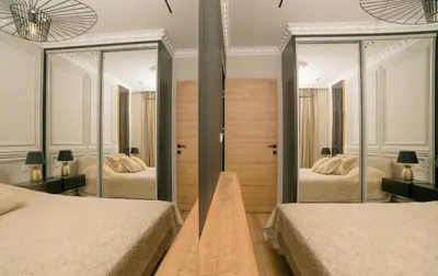 a bedroom with two beds and two mirrors at Luxury Apartment with Green Terrace, Porto Milena View and Private Garage in Ulcinj