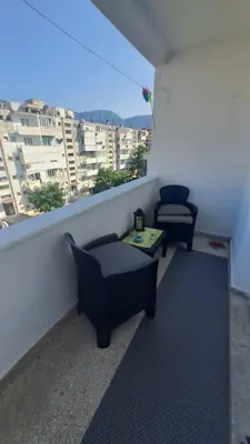 a room with two chairs and a table on a balcony at Odore di Bar in Bar
