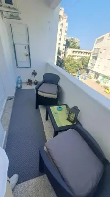 a room with two chairs and a table and a window at Odore di Bar in Bar