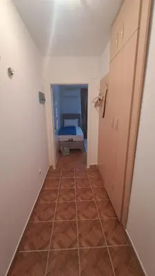 a hallway leading to a bedroom with a bed at Odore di Bar in Bar