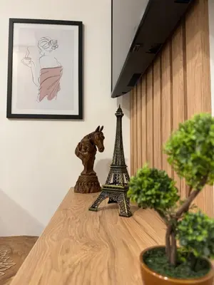 a table topped with a figurine of the eiffel tower at Oasis of peace in Budva