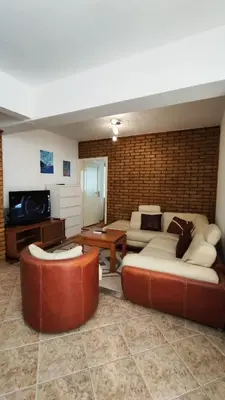 a living room with two couches and a tv at Apartman Centar Bar in Bar