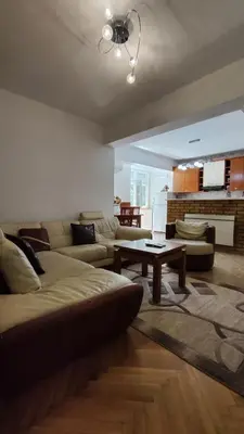 a living room with a couch and a table at Apartman Centar Bar in Bar