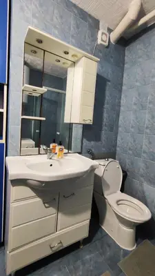 a bathroom with a white sink and a toilet at Apartman Centar Bar in Bar