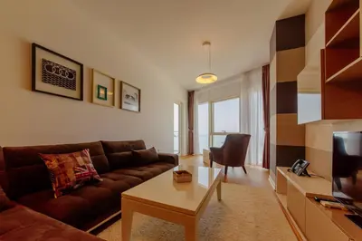 a living room with a couch and a table at Hotel Tre Canne in Budva