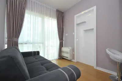 a living room with a couch and a window at Hotel Tre Canne in Budva