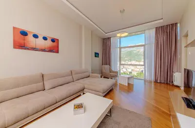 a living room with a couch and a table at Hotel Tre Canne in Budva