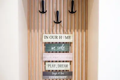 a book shelf with books and signs on it at Dusan Residency in Kotor