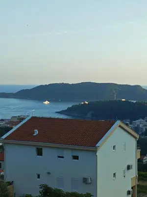 a white building with a view of the water at Vila Varagic in Budva