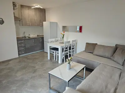 a living room with a couch and a table at Vila Varagic in Budva