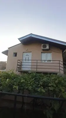a house with a balcony and a bunch of plants at Urban Retreat Dalmatinska in Podgorica