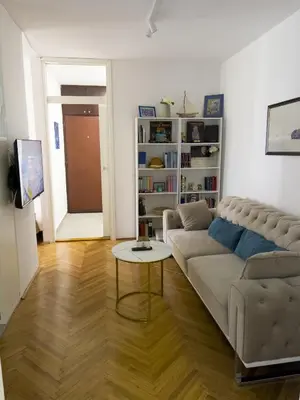 a living room with a couch and a table at Bar Centar Lux in Bar