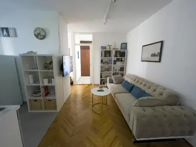 a living room with a couch and a table at Bar Centar Lux in Bar