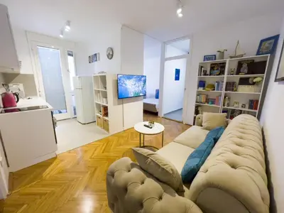 a living room with a couch and a tv at Bar Centar Lux in Bar