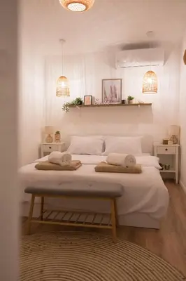 a bedroom with two beds and two lights at Case del Tramonto in Kotor