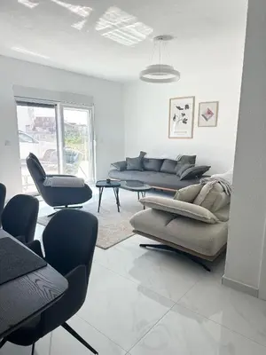 a living room with three couches and chairs in it at L U X V I L A, Dobre Vode in Dobra Voda
