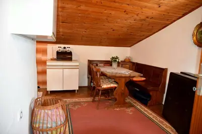 a room with a table and a kitchen with a counter at Valdanos in Ulcinj