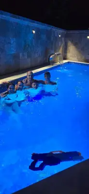 a group of people in a swimming pool at Aquamarine Jaz Montenegro in Budva