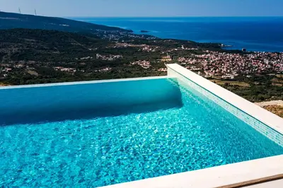 a swimming pool with a view of the ocean at Green Hills Villa in Bar
