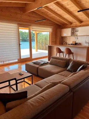 a living room with a couch and a kitchen at Gold fish3 in Ulcinj