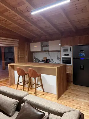 a kitchen with a table and a couch in a room at Gold fish3 in Ulcinj