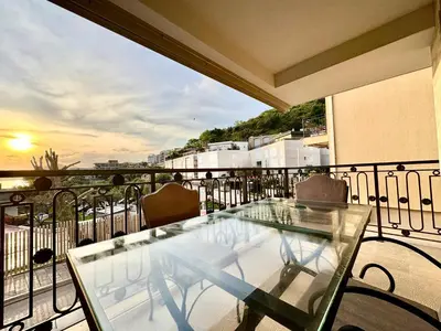 a glass table on a balcony with a view at Luxury Apartments Przno in Budva