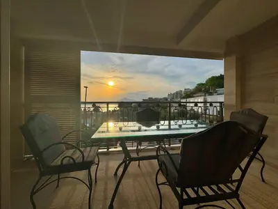 a balcony with a table and chairs on a balcony at Luxury Apartments Przno in Budva
