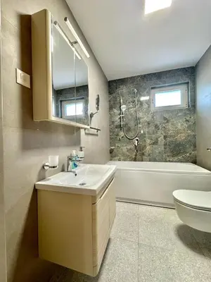 a bathroom with a sink and a shower and a toilet at Luxury Apartments Przno in Budva