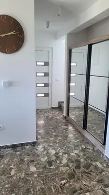 an empty room with a clock on a wall at Villa Moonlight in Budva
