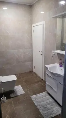 a bathroom with a white toilet and a sink at Villa Moonlight in Budva