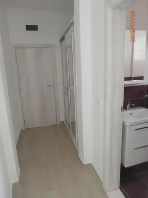 a white bathroom with a sink and a toilet at Sea Violet in Ulcinj