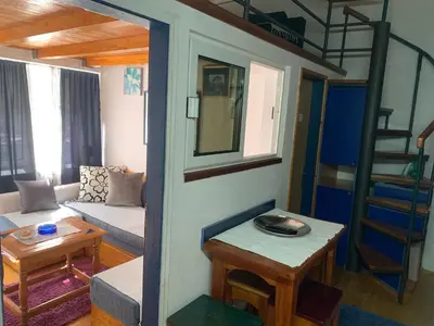 a living room with a couch and a bunk bed at Apartman Tina Gurdić in Kotor