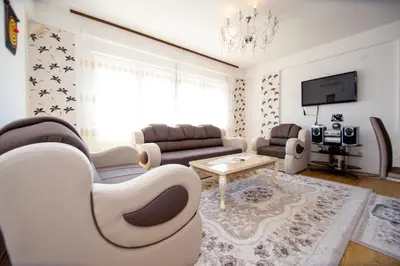 a living room with a couch and a table at Sea view Lazi in Budva
