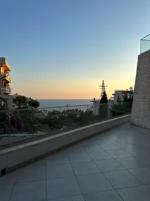 a view of the ocean from a balcony at Exclusive Apartments in Ulcinj