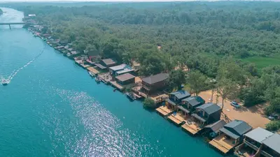 an aerial view of a resort on the water at Villa Boga on Ada Bojana in Gornji Štoj