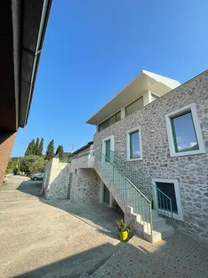 a building with stairs and a stair case on it at Happy Holiday House Hava in Ravanj