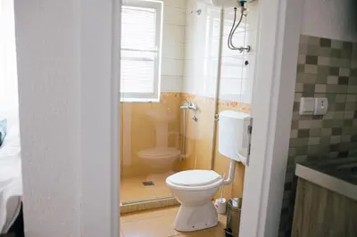 a bathroom with a shower and a toilet in it at Premium apartments in Ulcinj