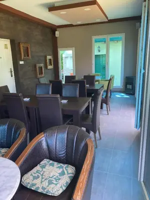 a dining room with tables and chairs and tablesktop at Izletiste Pocivala in Podgorica