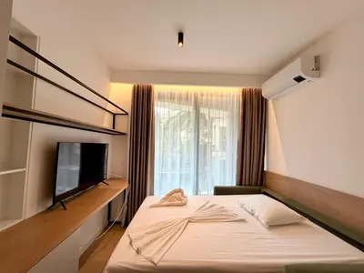 a hotel room with a bed and a television at Two bedroom apartment Onia - Budva in Budva