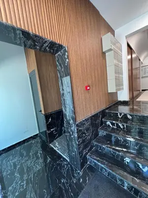a marble staircase in a room with a mirror at Montenegro Suite Rental in Bar