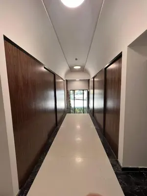 a hallway with wooden walls at Montenegro Suite Rental in Bar