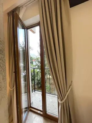 a sliding glass door leading to a balcony at 13 July apartment in Budva