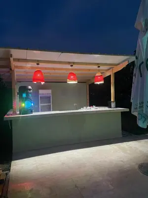 a bar with red lights on top of it at night at Stefhouse in Mojanovići