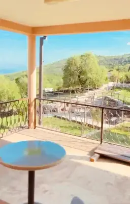a balcony with a table and a view at Etno Selo - Familie Raickovic in Podgorica