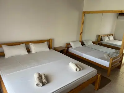 two beds in a room with towels on them at Konoba Ceklin in Cetinje