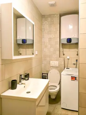 a bathroom with a white sink and a toilet at Juzni Horizont Apartments in Sutomore